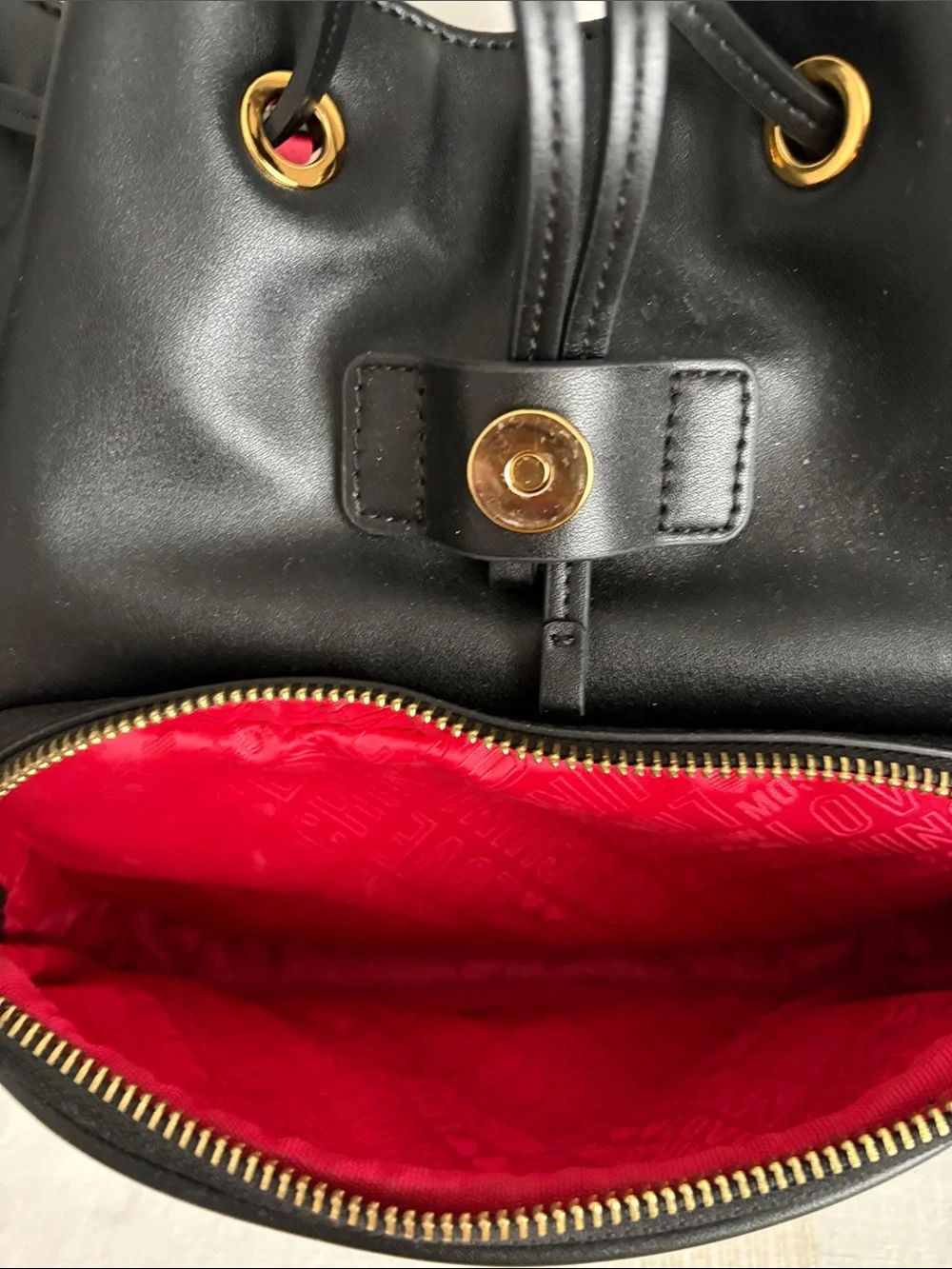 BNWOT Designer LOVE MOSCHINO Backpack, Faux Leather, with gold metal design.
